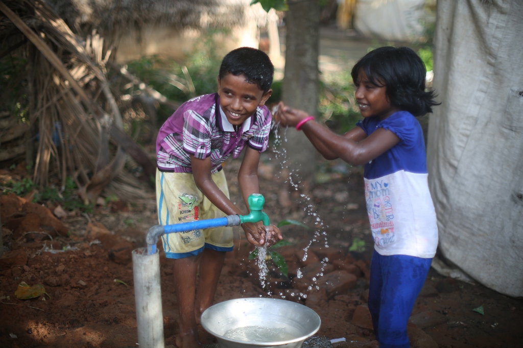 Children with clean water tap